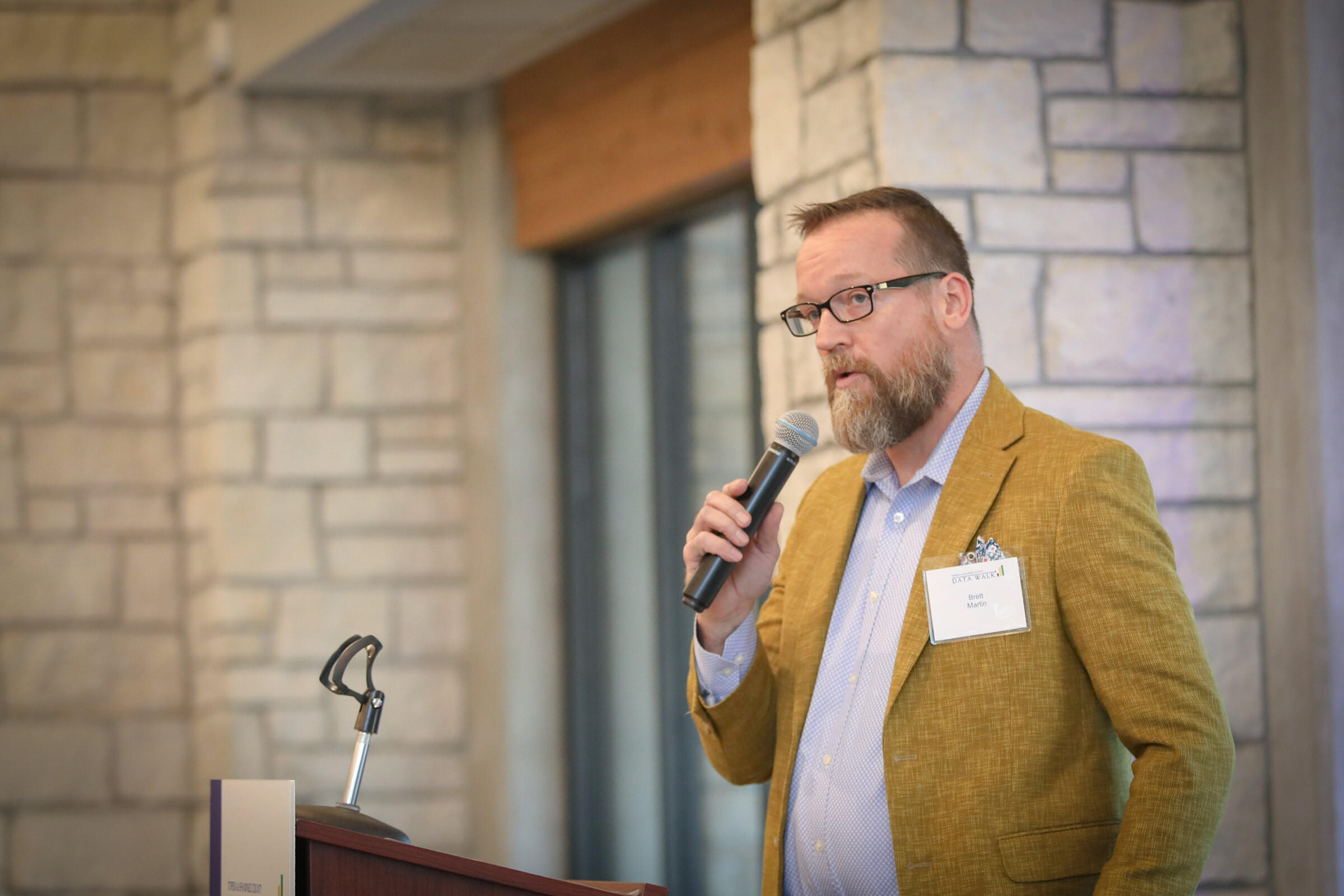 A Data Walk presenter speaks to participants