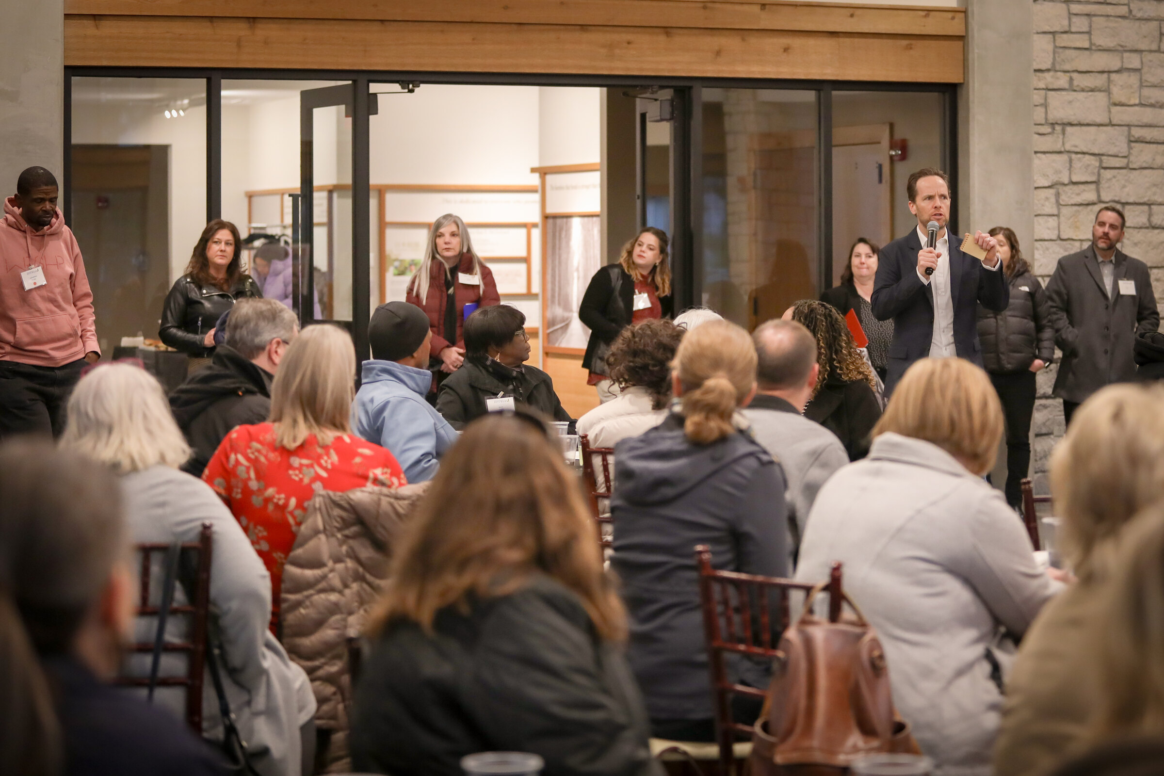 A presenter addresses a full Data Walk gathering