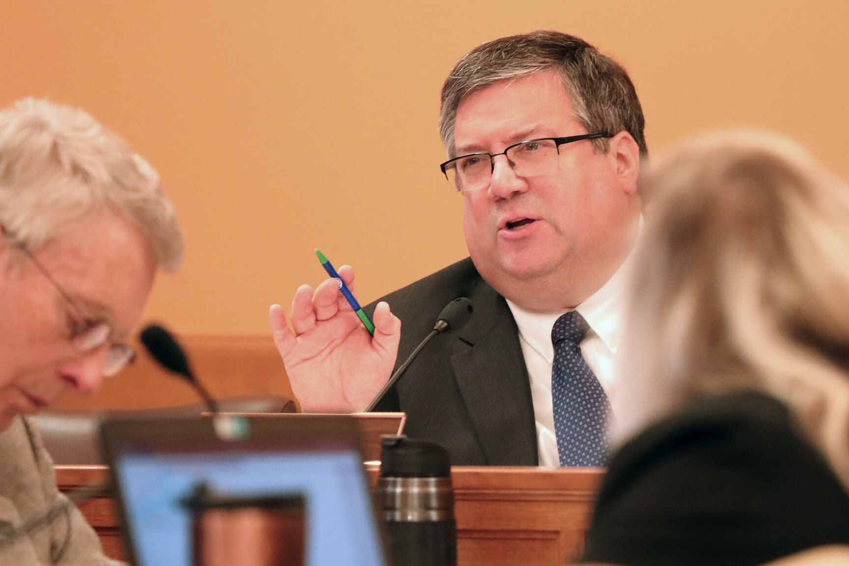 A legislator speaks during committee discussion