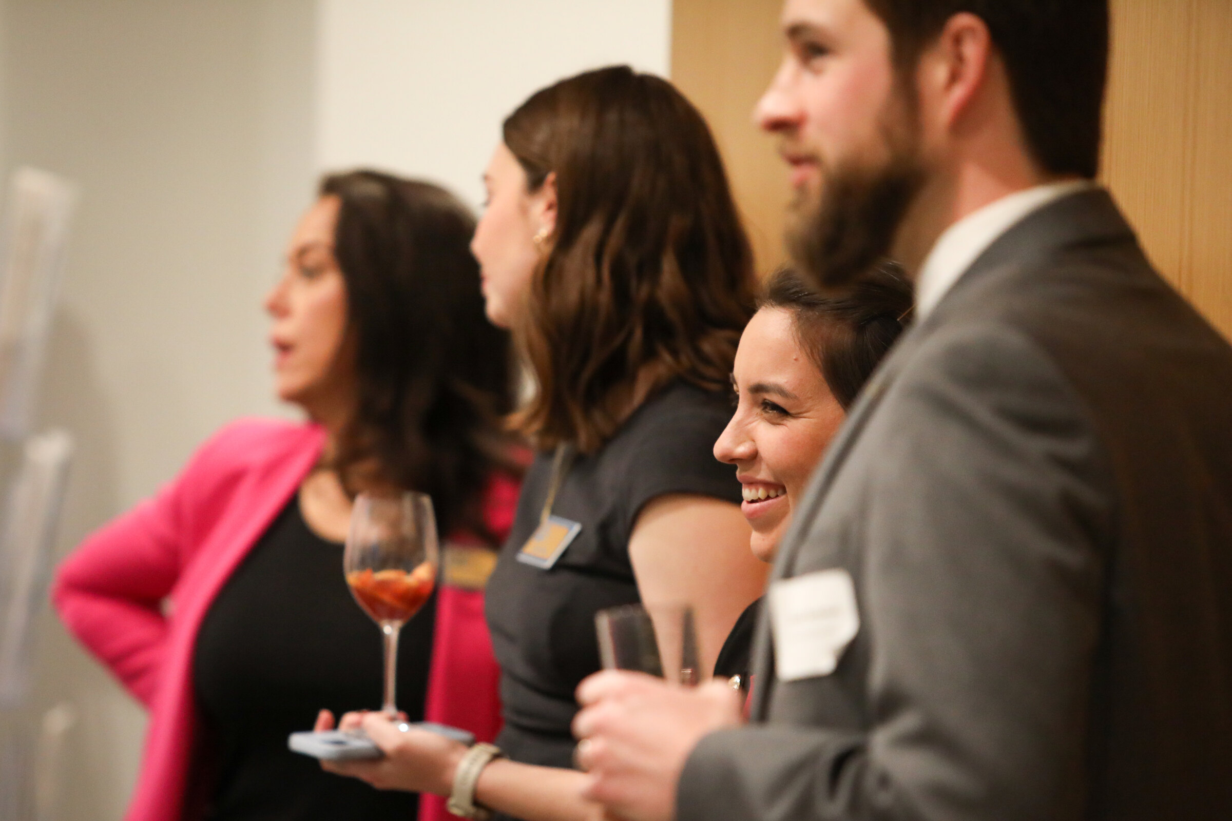 Guests react during a legislative open house