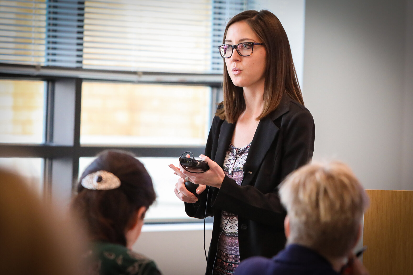 A presenter speaks at a KHI convening